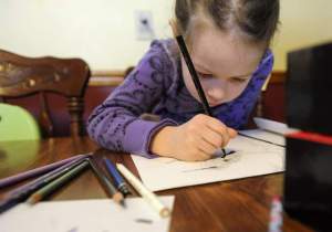 Madison Grimm' works on her artwork. Photo: Emily Spartz, The Argus Leader.