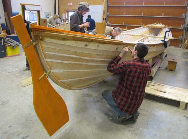 Great Lakes Boat Building School students work on one of seven authentic whaleboat replicas that will launch with the Charles W. Morgan this summer. Photo: Courtesy Great Lakes Boat Building School