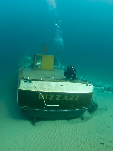 Paul Chase diving on the Pizzazz during an earlier dive. The wreck is located 3 miles west of Little Point Sable Light. Photo: Debbie Chase