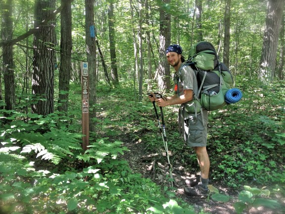 Luke Jordan pauses while hiking the North Country Trail. Photo: Beth Keloneva.