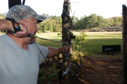 Mike Niva aims at a Javelina on the 3-D target range at Fruitport Conservation Club. Photo: Howard Meyerson