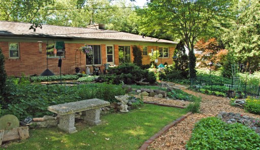 Mary Jane Dockeray's back yard, with all its gardens, bird feeders and fountain, is her "playpen." Photo: Howard Meyerson