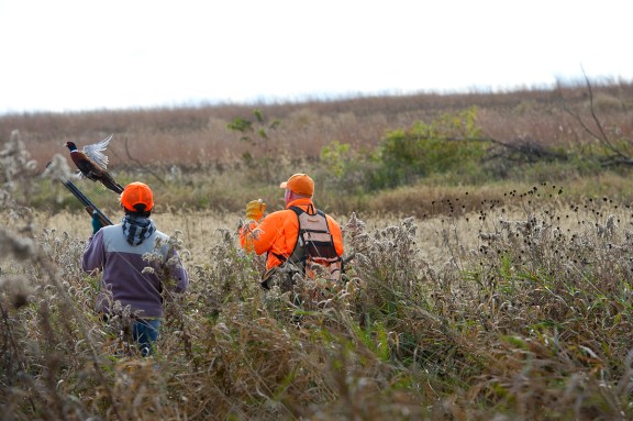 Alyssa Wethington gets some coaching from  and Scott Brosier.  Photo: Dave Kenyon, Michigan DNR