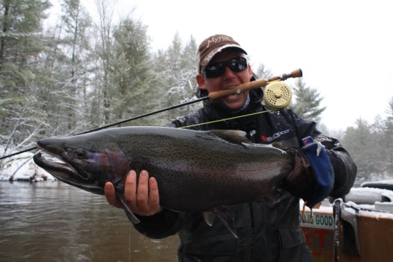 Show host, Mark Melnyk, hoists one of many steelhead that were caught during the shoot. Photo: Courtesy Mark Melnyk.