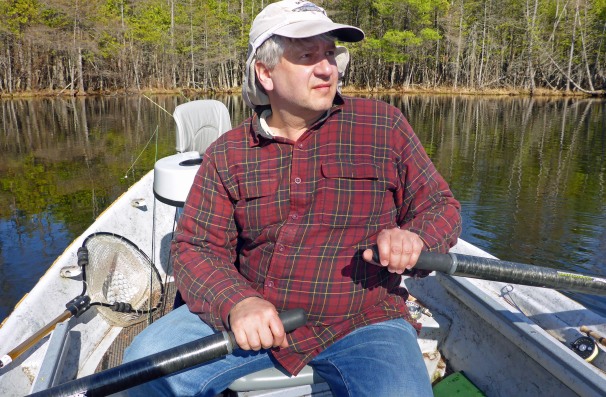 Jeff Johnson rows around Brookhaven Lake on an early spring outing looking for brookies and grayling. Photo: Howard Meyerson