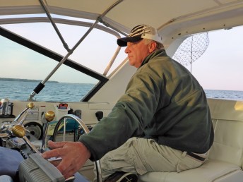 Captain Russ Clark steers his boat, Sea Hawk, into prime fishing waters  just after sunrise. Photo: Howard Meyerson