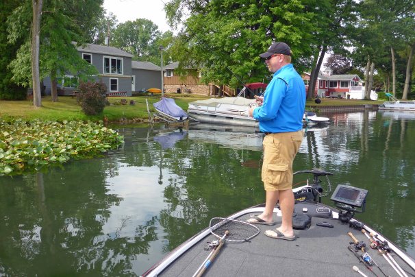 Miles Hanley, the 1998 Michigan State Bass Champion works shoreline structures and vegetation for bass. Photo: Howard Meyerson