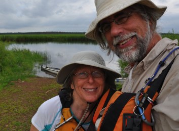 Day 7 near Grand Rapids, MN, the De Kocks shoot a  selfie with the narrow river waters behind them. Photo: Gary De Kock.