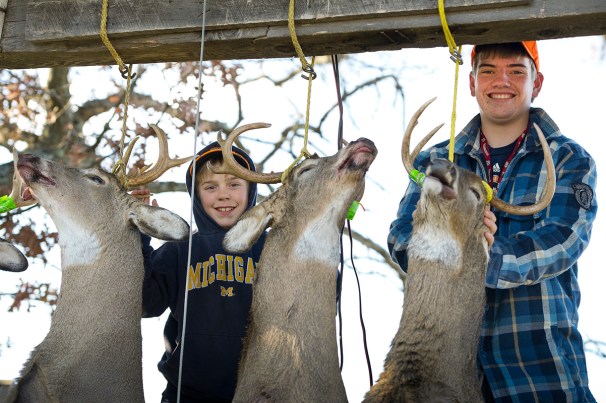 Pictured are 13-year-old Henry Lerrett and Zach Parrett, 16, standing proudly with nice healthy racked bucks at their camp in Menominee County last deer season. (Courtesy | David Kenyon, Michigan DNR)