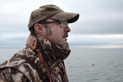 Hank Shaw scans for diving ducks while hunting. Photo: Holly Heyser.