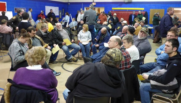 State parks chief Ron Olson and Sen. Geoff Hansen (upper right) discuss the issues as ORV enthusiasts form groups and attempt to develop solutions. Photo; Howard Meyerson.