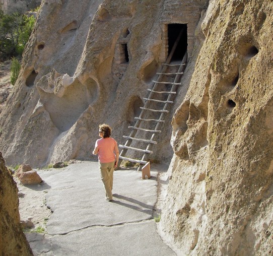 A visitor explores the ancient cliff dwellings at Bandelier National Monument in New Mexico. Photo: Howard Meyerson