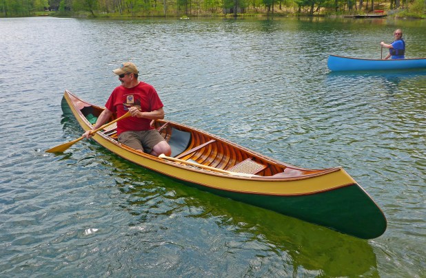  WCHA member Dave McDaniel, of Oscoda (foreground), and WCHA president, Ken Kelly, of Grand Rapids, enjoy a paddle in wood canoes in early summer. Photo:  Howard Meyerson
